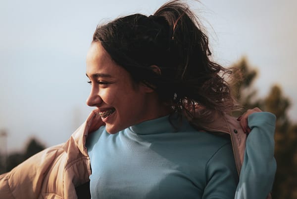 a woman with her hair in the wind